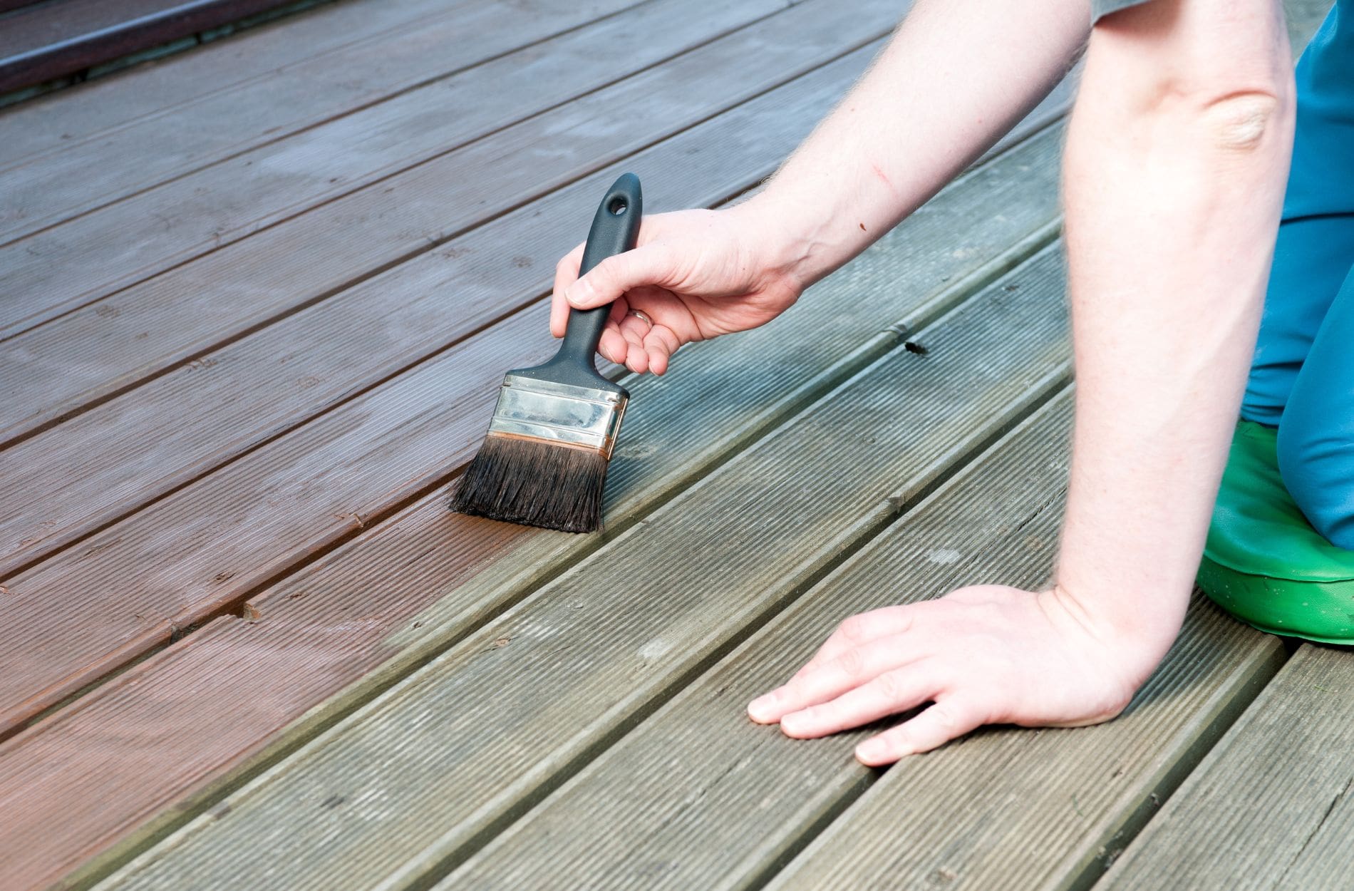 Highfill worker painting a deck in RIchmond VA