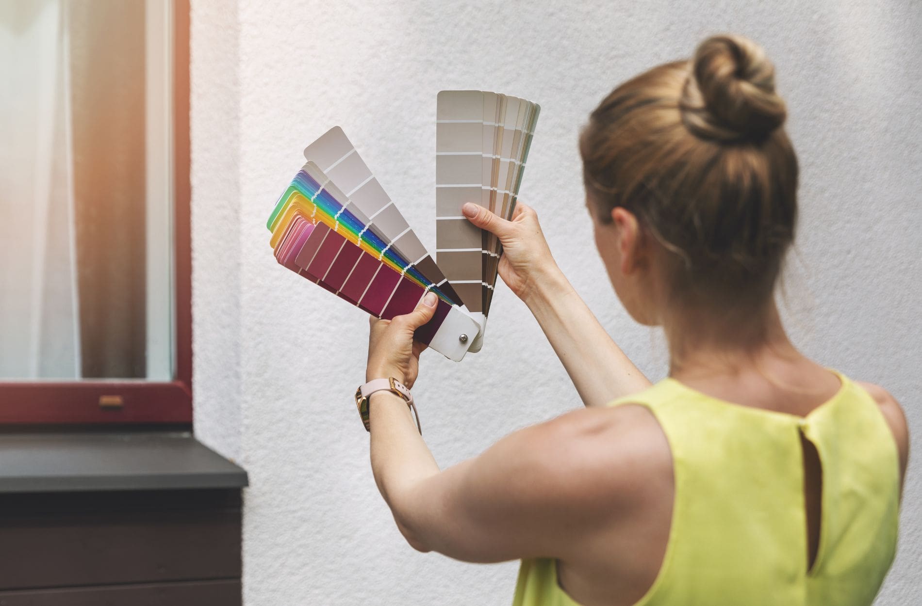 Womam deciding what paint colors to choose