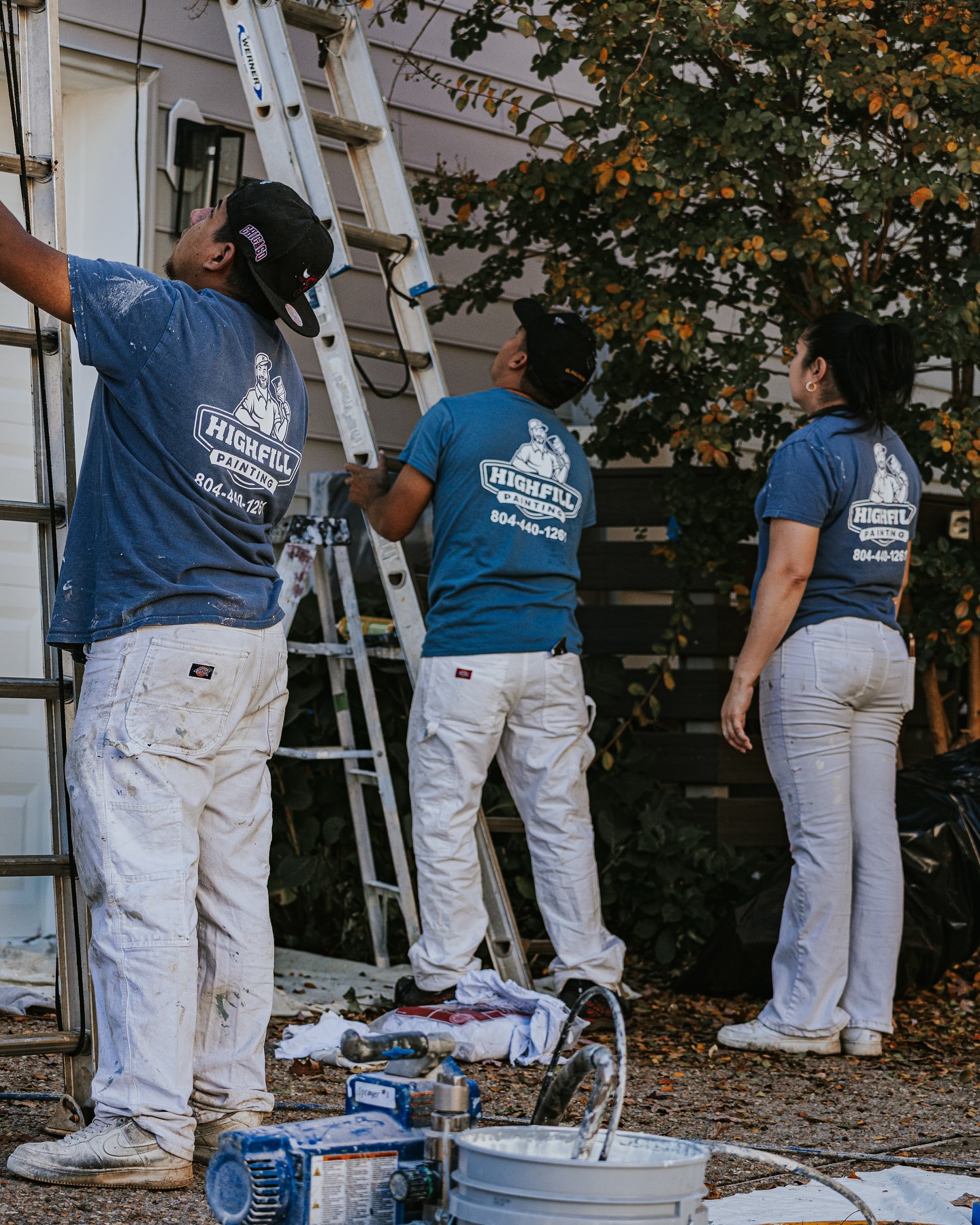 Highfill worker painting the outside of a home in Richmond, VA.