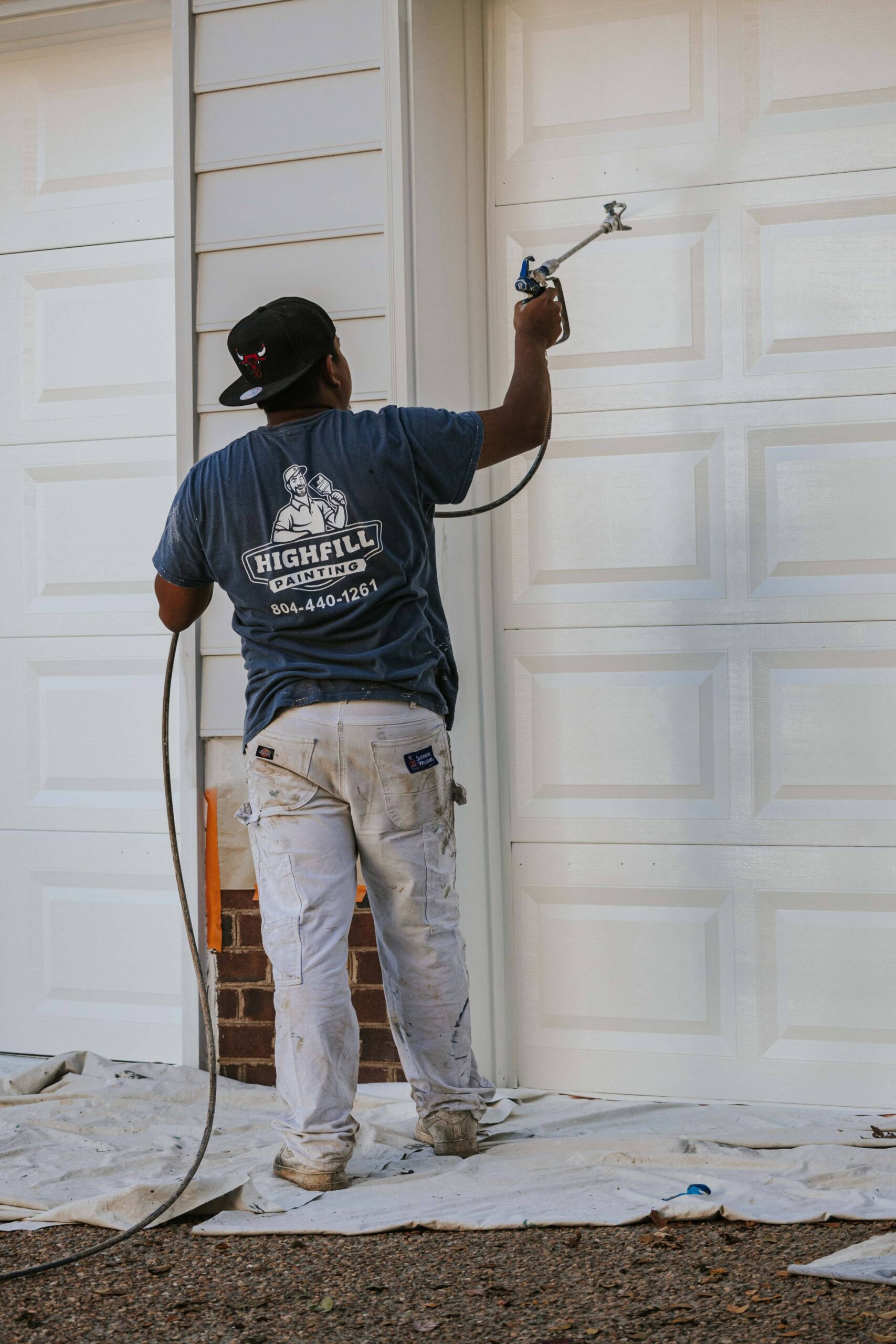 Highfill worker painting the outside of a home in Richmond, VA.